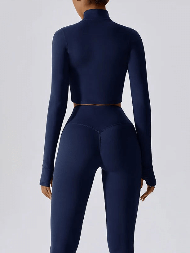 Women's navy quick-drying long-sleeved yoga shirt with zipper, perfect for workouts, back view of athletic fit.